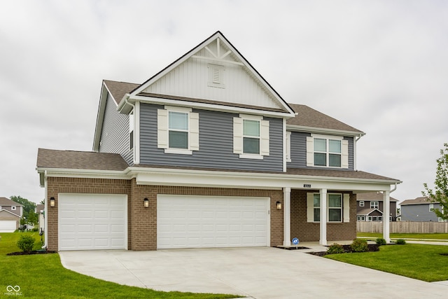 6143 Madera Dr, Whitestown, IN 46075 - view of front facade with an attached garage, concrete driveway, brick siding, and roof with shingles