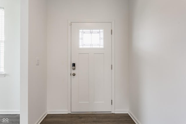 6143 Madera Dr, Whitestown, IN 46075 - foyer featuring dark wood finished floors and baseboards