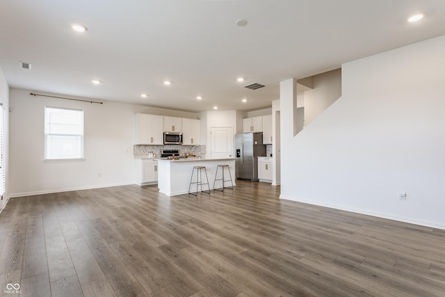 6143 Madera Dr, Whitestown, IN 46075 - unfurnished living room featuring dark wood-style flooring and recessed lighting