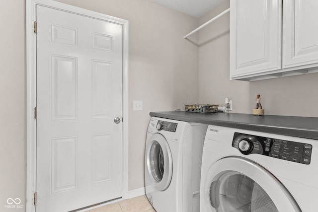 866 Rosalind Pl, Carmel, IN 46032 - laundry room with cabinet space, washer and clothes dryer, and light tile patterned floors