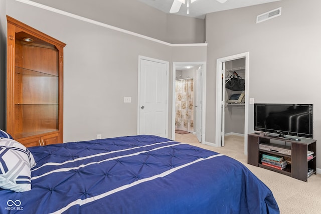 866 Rosalind Pl, Carmel, IN 46032 - bedroom featuring carpet, a spacious closet, connected bathroom, and ceiling fan
