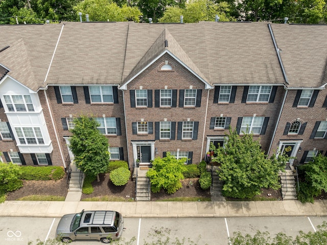 866 Rosalind Pl, Carmel, IN 46032 - view of building exterior with stairs and uncovered parking