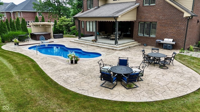 4545 Pascagoula Run, Greenwood, IN 46143 - outdoor pool with a patio area, outdoor dining space, a covered hot tub, grilling area, and a yard