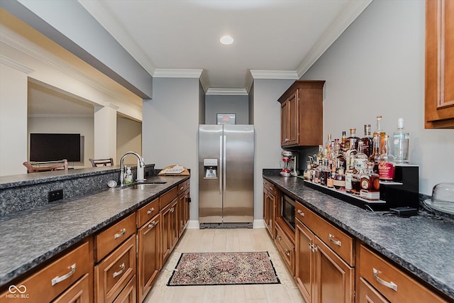 4545 Pascagoula Run, Greenwood, IN 46143 - kitchen with appliances with stainless steel finishes, brown cabinets, crown molding, dark stone countertops, and recessed lighting