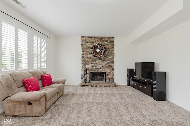 12291 Cobblestone Dr, Fishers, IN 46037 - living area featuring carpet flooring and a stone fireplace