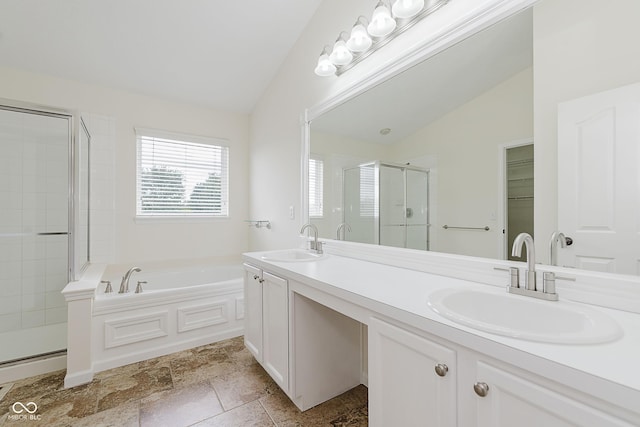 12291 Cobblestone Dr, Fishers, IN 46037 - full bathroom with vaulted ceiling, a stall shower, double vanity, and a bath