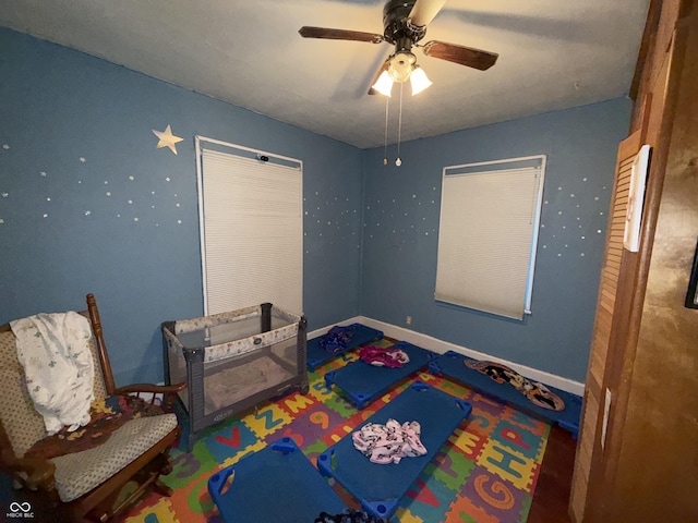 3209 Forest Ter, Anderson, IN 46013 - rec room with ceiling fan and baseboards