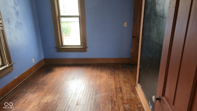 1338 Glenn Ave, Wabash, IN 46992 - spare room featuring baseboards and hardwood / wood-style floors
