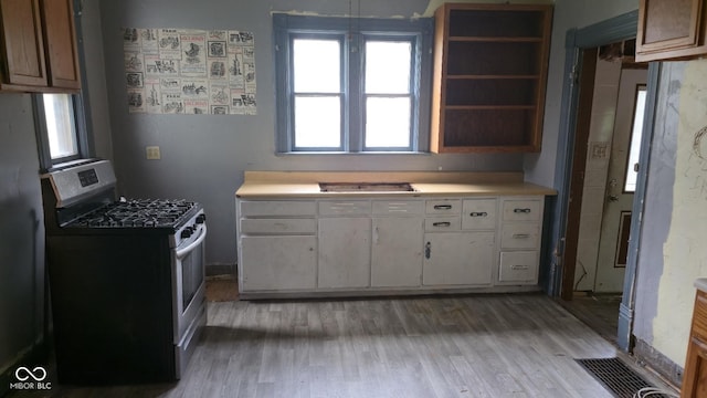 1338 Glenn Ave, Wabash, IN 46992 - kitchen featuring gas stove, light countertops, and light wood finished floors