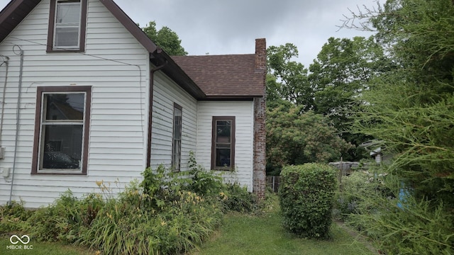 1338 Glenn Ave, Wabash, IN 46992 - view of property exterior with a chimney and a shingled roof
