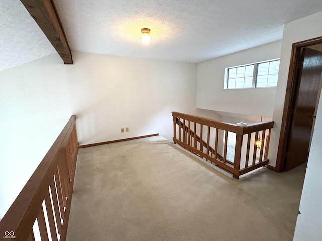 6458 Watham Ct, Indianapolis, IN 46250 - corridor featuring an upstairs landing, carpet floors, a textured ceiling, and beamed ceiling