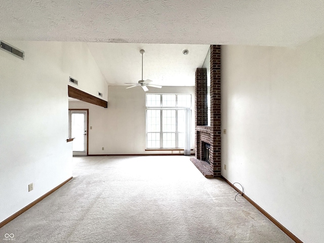 6458 Watham Ct, Indianapolis, IN 46250 - unfurnished living room featuring a ceiling fan, carpet flooring, a fireplace, a textured ceiling, and vaulted ceiling