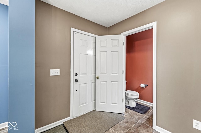 12034 Gatwick View Dr, Fishers, IN 46037 - bathroom featuring a textured ceiling and tile patterned flooring