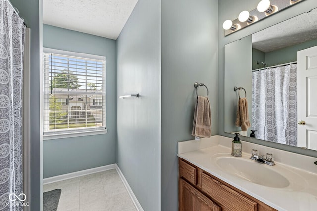 12034 Gatwick View Dr, Fishers, IN 46037 - full bath with a textured ceiling, vanity, and tile patterned floors
