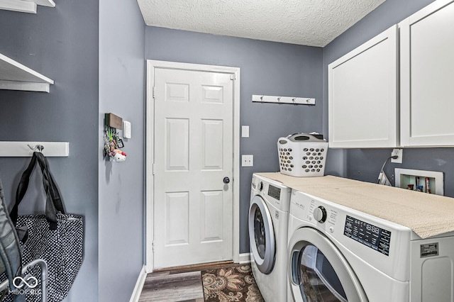 12034 Gatwick View Dr, Fishers, IN 46037 - laundry area with washing machine and clothes dryer, cabinet space, wood finished floors, and a textured ceiling