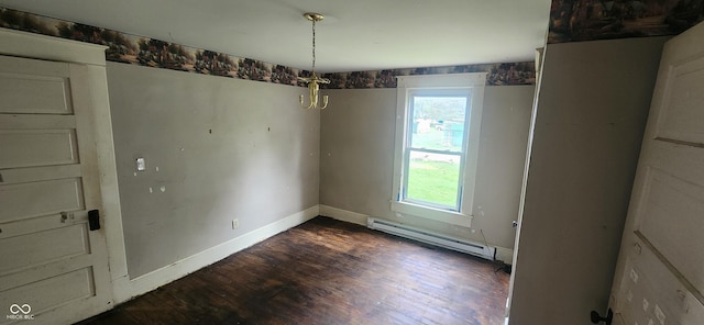 308 E Washington St, Saint Paul, IN 47272 - unfurnished dining area with a baseboard heating unit, healthy amount of natural light, and dark wood-type flooring