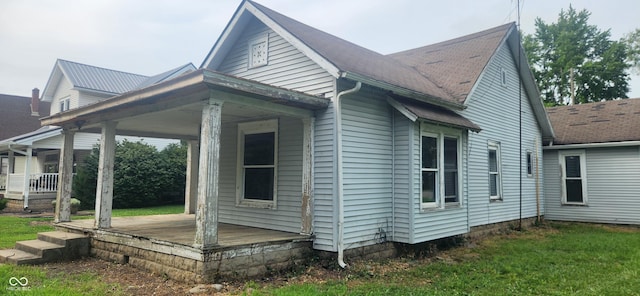 308 E Washington St, Saint Paul, IN 47272 - view of side of home with covered porch