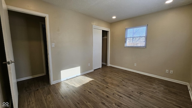 4107 Weaver Ave, Indianapolis, IN 46227 - unfurnished bedroom featuring dark wood finished floors, recessed lighting, a closet, and a textured ceiling
