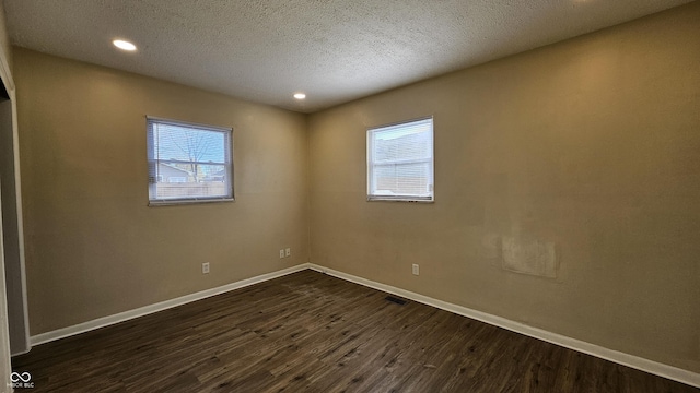 4107 Weaver Ave, Indianapolis, IN 46227 - spare room with dark wood finished floors, a textured ceiling, and recessed lighting