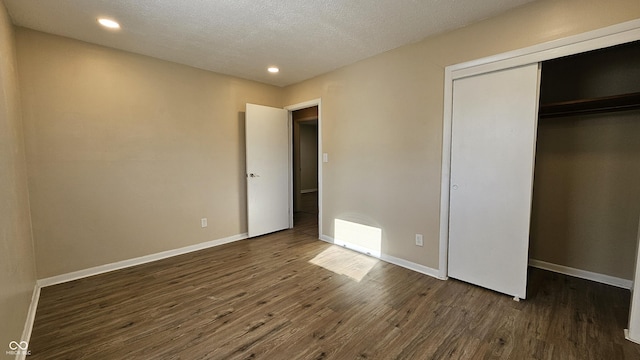4107 Weaver Ave, Indianapolis, IN 46227 - unfurnished bedroom featuring dark wood-type flooring, recessed lighting, and a closet