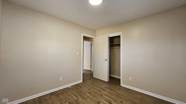 4107 Weaver Ave, Indianapolis, IN 46227 - unfurnished bedroom with dark wood-style floors and a closet
