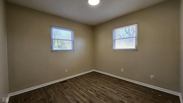 4107 Weaver Ave, Indianapolis, IN 46227 - spare room with baseboards and dark wood-style floors