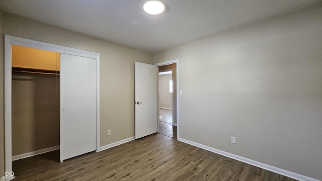 4107 Weaver Ave, Indianapolis, IN 46227 - unfurnished bedroom with wood finished floors and a closet
