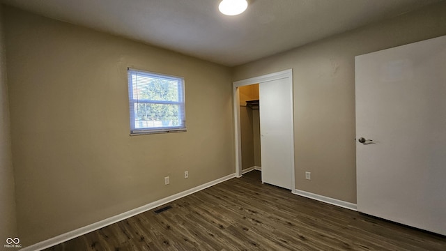 4107 Weaver Ave, Indianapolis, IN 46227 - unfurnished bedroom featuring dark wood-style flooring and a closet