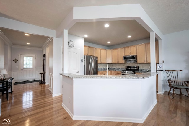 12985 Merlot Ln, Fishers, IN 46037 - kitchen with stainless steel appliances, light brown cabinetry, decorative backsplash, light wood-type flooring, and crown molding