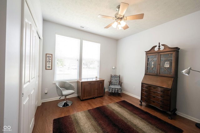 12985 Merlot Ln, Fishers, IN 46037 - living area featuring light wood-style floors, a ceiling fan, and a textured ceiling