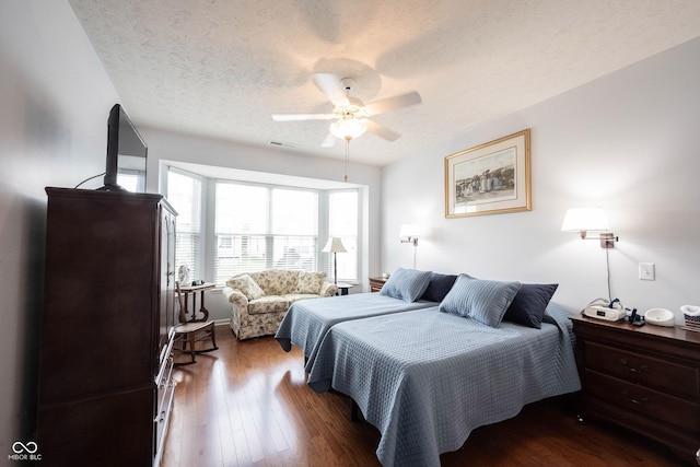 12985 Merlot Ln, Fishers, IN 46037 - bedroom featuring wood finished floors, a textured ceiling, and a ceiling fan