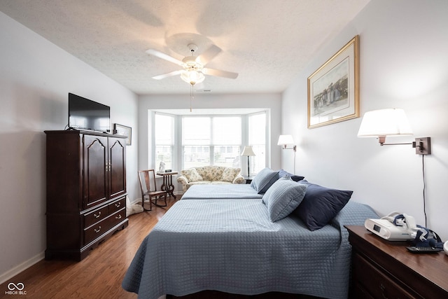 12985 Merlot Ln, Fishers, IN 46037 - bedroom featuring light wood-style flooring, a textured ceiling, and ceiling fan