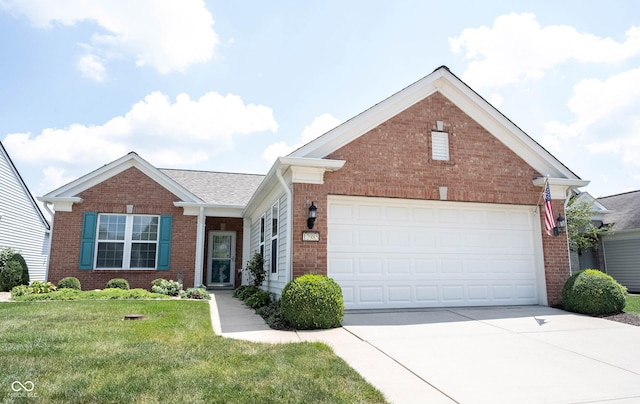 12985 Merlot Ln, Fishers, IN 46037 - view of front of house featuring brick siding, a front lawn, concrete driveway, and an attached garage