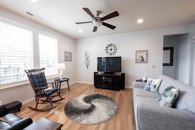 12985 Merlot Ln, Fishers, IN 46037 - living room with a ceiling fan, light wood finished floors, and recessed lighting