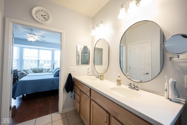 12985 Merlot Ln, Fishers, IN 46037 - bathroom featuring ensuite bathroom, double vanity, tile patterned floors, and a ceiling fan