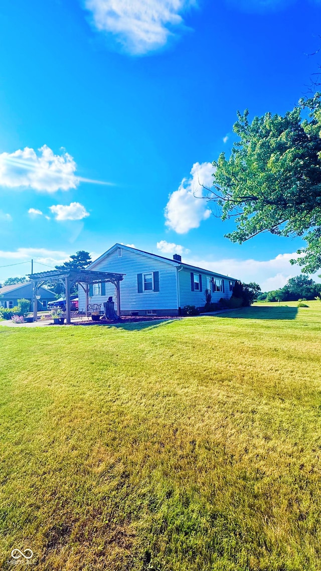 5964 E 250 N, Greenfield, IN 46140 - rear view of house featuring a pergola and a lawn