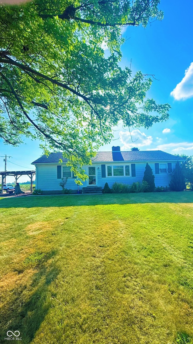 5964 E 250 N, Greenfield, IN 46140 - ranch-style home with a front yard and a chimney
