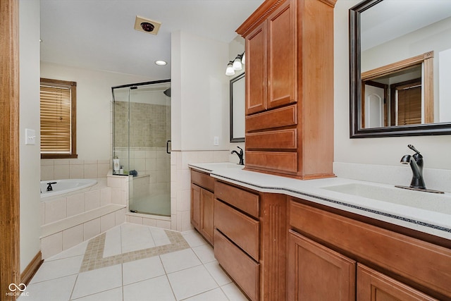 7178 Lockford Walk N, Avon, IN 46123 - bathroom with tile patterned floors, a shower stall, a garden tub, double vanity, and recessed lighting