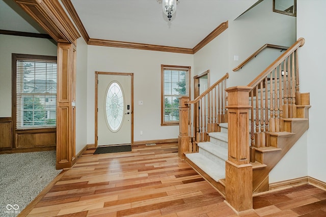 7178 Lockford Walk N, Avon, IN 46123 - entrance foyer with ornamental molding, light wood finished floors, and stairway