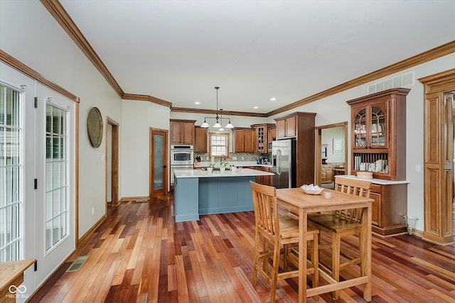 7178 Lockford Walk N, Avon, IN 46123 - dining room with dark wood-style flooring, a chandelier, crown molding, and recessed lighting