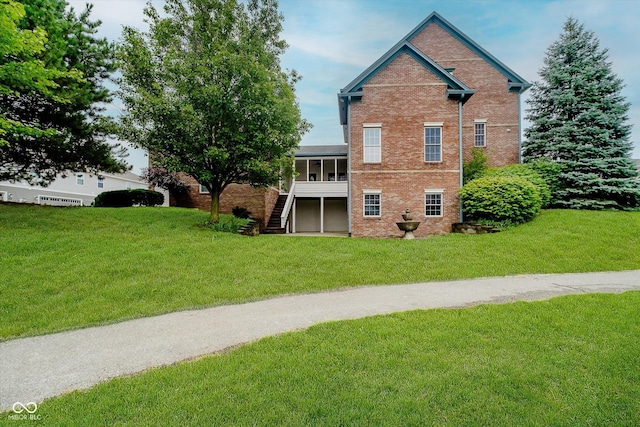 7178 Lockford Walk N, Avon, IN 46123 - rear view of property with stairway, brick siding, and a yard
