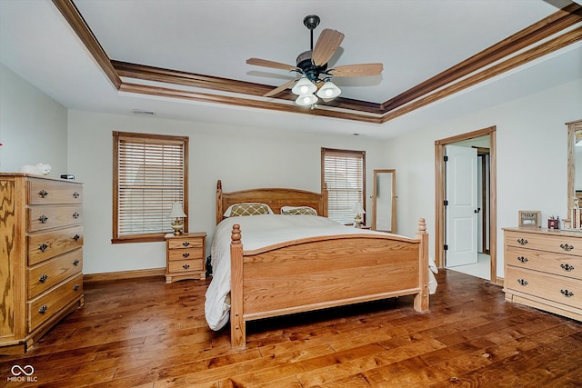7178 Lockford Walk N, Avon, IN 46123 - bedroom with a raised ceiling, crown molding, hardwood / wood-style flooring, and ceiling fan