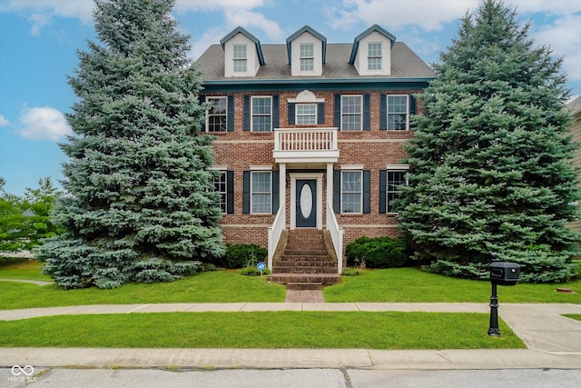 7178 Lockford Walk N, Avon, IN 46123 - colonial-style house with brick siding and a front yard