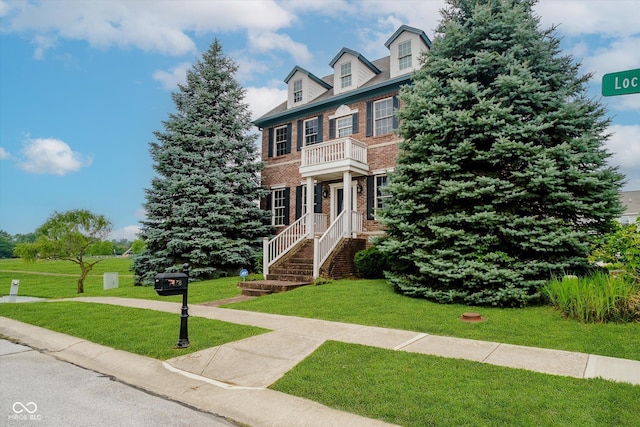 7178 Lockford Walk N, Avon, IN 46123 - colonial inspired home with brick siding, a front lawn, and a balcony