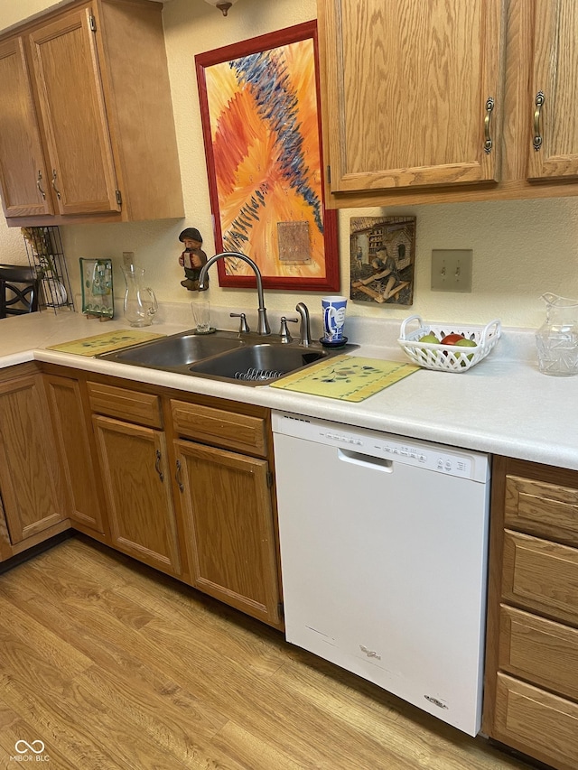5333 Thornridge Pl, Indianapolis, IN 46237 - kitchen with white dishwasher, light wood-style floors, light countertops, and brown cabinets
