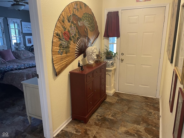 5333 Thornridge Pl, Indianapolis, IN 46237 - entryway with stone finish floors and ceiling fan