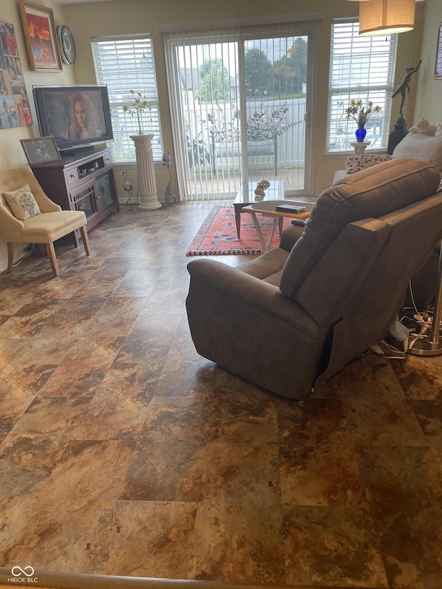 5333 Thornridge Pl, Indianapolis, IN 46237 - living room with healthy amount of natural light and stone finish floors