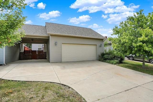 4219 Trilithon Ct, West Lafayette, IN 47906 - garage featuring driveway and a carport