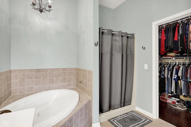 4219 Trilithon Ct, West Lafayette, IN 47906 - bathroom featuring a spacious closet, a bath, and a shower stall