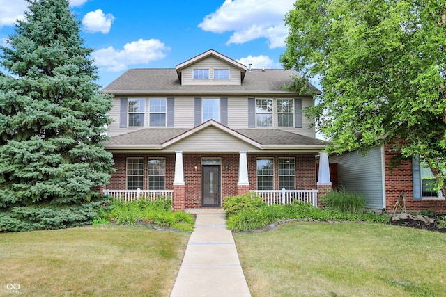 4219 Trilithon Ct, West Lafayette, IN 47906 - traditional style home with a porch, a front yard, and brick siding